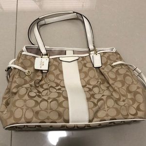 Coach woman’s purse, draw strings on side, light khaki, cream, new with tags